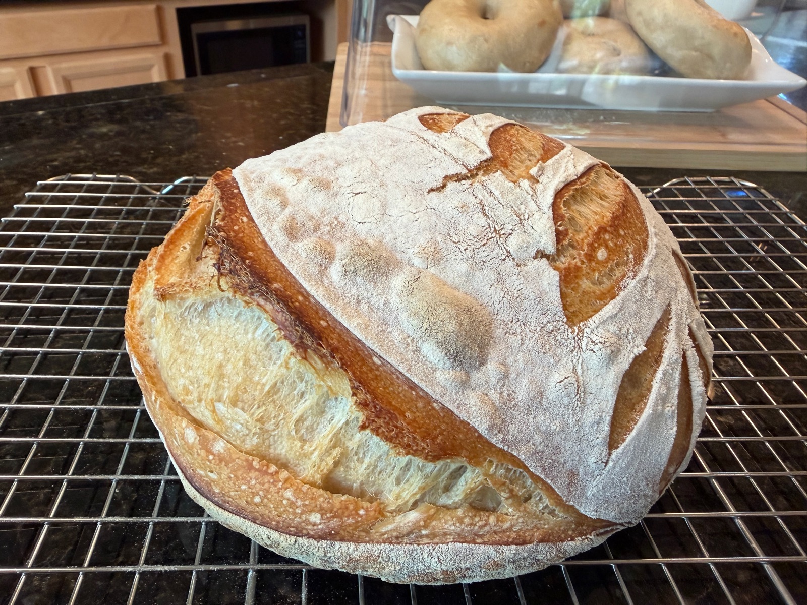 Top-down country loaf with leaf-pattern scoring.